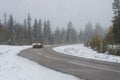 Car in blurred motion in bend of rural asphalt road Royalty Free Stock Photo