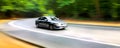 Car in blurred motion on road. Abstract background. Royalty Free Stock Photo