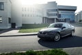 Car BMW Coupe E92 standing on asphalt road in city Minsk, Belarus near modern building at daytime Royalty Free Stock Photo