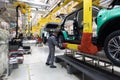 Car bodies are on assembly line. Factory for production of cars. Modern automotive industry. A car being checked before