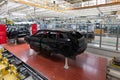 Car bodies are on assembly line. Factory for production of cars. Modern automotive industry. A car being checked before