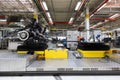 Car bodies are on assembly line. Factory for production of cars. Modern automotive industry. A car being checked before