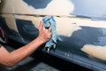 Car body work after the accident by cleaning before painting
