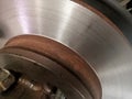 car brake disc plate, which is being repaired or its surface is being leveled again, using a lathe Royalty Free Stock Photo