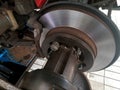 car brake disc plate, which is being repaired or its surface is being leveled again, using a lathe Royalty Free Stock Photo