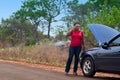 Car breakdown - African American woman call for help, road assistance. Royalty Free Stock Photo