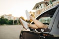 Car breakdown, female legs sticking out the window Royalty Free Stock Photo