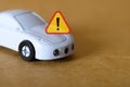 Car Breakdown Symbolized by Toy Vehicle and Warning Triangle for Maintenance Concepts Royalty Free Stock Photo