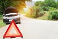 Car broken down on the road with emergency help sign. car break down trouble on road, traffic warning triangle sign on asphalt Royalty Free Stock Photo