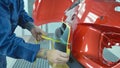 Car bumper after painting in a cars spray booth. Auto vehicle primer bumper.