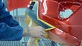 Car bumper after painting in a cars spray booth. Auto vehicle primer bumper.