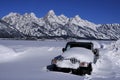 Car Buried in Snow in Winter with Teton Mountains in Background Royalty Free Stock Photo