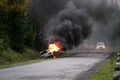 Car burning on road