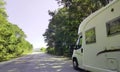 Car caravan on the road in spring moving Royalty Free Stock Photo