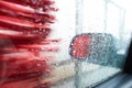 Car Care Business. Automatic Car Wash Process. Spray foam bubble shampoo on the car surface and Tire. Royalty Free Stock Photo