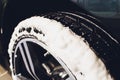 Car Care or Car Detailing Process. Using black sponge to washing the tire. blacker rubber. Royalty Free Stock Photo