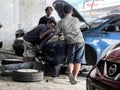 Car care maintenance and servicing, Close-up hand technician auto mechanic using the wrench to repairing. Bekasi, Indonesia,