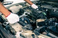 Close-up hand technician auto mechanic using the wrench to repairing change spare part car