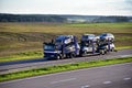 Car carrier trailer transports cars on highway on sunset background. Auto transport and car shipping services concept. Truck with Royalty Free Stock Photo