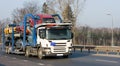 Car carrier truck deliver new auto batch to dealer Royalty Free Stock Photo