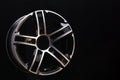 Car cast aluminum alloy wheels, black silver with polished front, very beautiful and modern, fashion. Close-up on dark background Royalty Free Stock Photo