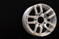 Car cast aluminum alloy wheels, black silver with polished front, very beautiful and modern, fashion. Close-up on dark background Royalty Free Stock Photo