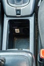 Car center console with USB port and 12V outlet beside parking brake button Royalty Free Stock Photo