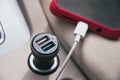 car charger for phone plugged into cigarette lighter