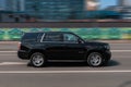 car Chevrolet Tahoe Third generation driving fast on the city streets with motion blur Royalty Free Stock Photo