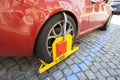 Car clamped on cobbled street Royalty Free Stock Photo