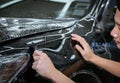 Car cleaning auto service : the man cleaning and polishes. car detailing concepts. Selective focused
