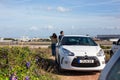 Car and Couple Watching Planes at Airport Royalty Free Stock Photo