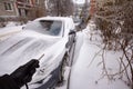 Car is covered icicles, snow and ice. Cleaning of snowdrift. Access problems. Royalty Free Stock Photo