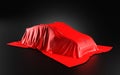 Car Covered with a Red Satin Cloth in a Exhibition for Unveiling on black background - 3D Illustration Render