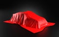 Car Covered with a Red Satin Cloth in a Exhibition for Unveiling on black background - 3D Illustration Render Royalty Free Stock Photo
