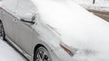 The car is covered with snow, the car is covered with an avalanche