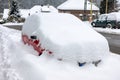 Car covered by snow. Hard winter in city