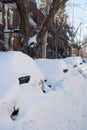 Car covered of snow in a street in Canada