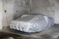 Car covered under silver sheet