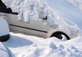 A car is covered by white snow Royalty Free Stock Photo