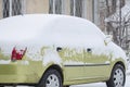 The car is covered with white snow. After a snowstorm Royalty Free Stock Photo