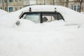 Car covered with white snow in winter Royalty Free Stock Photo