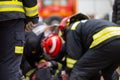 Car Crash Traffic Accident. Firefighters Rescue Injured Trapped Victims. Firemen give First Aid to passengers.