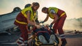 On the Car Crash Traffic Accident Scene: Paramedics Saving Life of a Female Victim who is Lying on Royalty Free Stock Photo