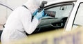 Car, crime scene and forensic photographer with pictures for evidence in court, working and investigation. Adult, person Royalty Free Stock Photo