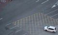 Car crossing empty lanes in Barcelona