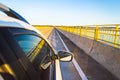 Car crossing the bridge Helio Serejo over the Parana river