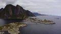 Car crossing a bridge in sunny, summer day in Reine, Lofoten, Norway - Aerial view