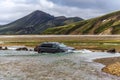Car crossing Jokulgilskvisl river flow in Fridland ad Fjallabaki Natural park in Highlands of Iceland