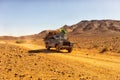 Car crossing Sahara desert